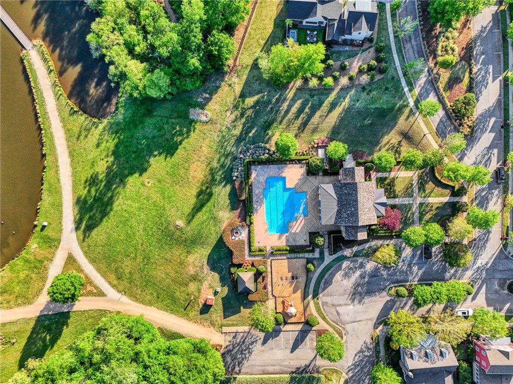 308 Pershing Avenue Clemson, SC 29631 - Photo 30 of 31 This aerial perspective showcases a community pool and vibrant green spaces, offering recreational opportunities.
