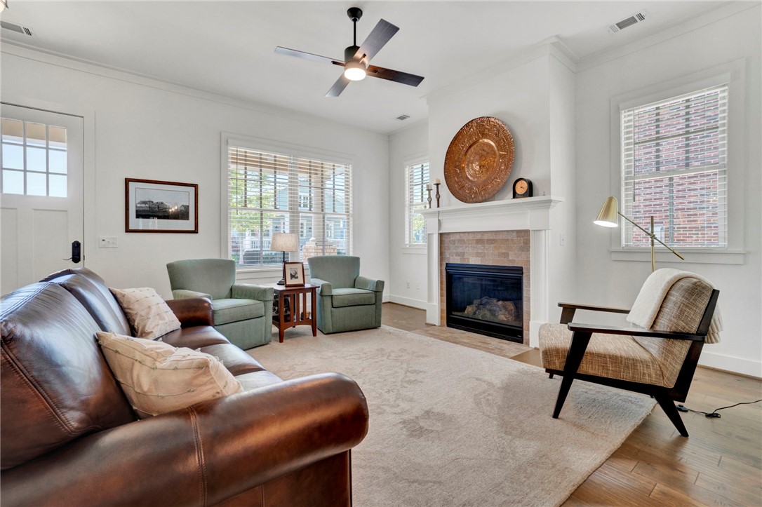 308 Pershing Avenue Clemson, SC 29631 - Photo 3 of 31 This inviting living room boasts a cozy fireplace and warm hardwood floors, perfect for relaxing evenings.