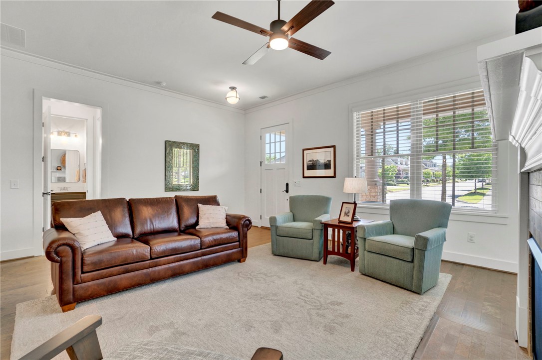 308 Pershing Avenue Clemson, SC 29631 - Photo 4 of 31 This inviting living space features high ceilings and hardwood flooring, perfect for comfortable gatherings.