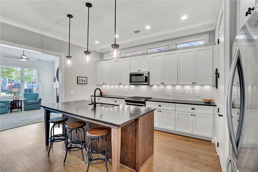 308 Pershing Avenue Clemson, SC 29631 - Photo 5 of 31 This bright kitchen features sleek appliances and a spacious island, perfect for culinary adventures.
