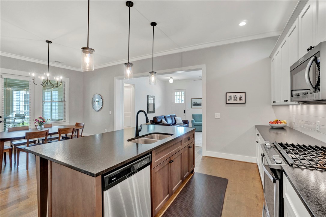 308 Pershing Avenue Clemson, SC 29631 - Photo 6 of 31 This bright kitchen offers a central island, modern appliances, and seamless flow into adjacent living spaces.
