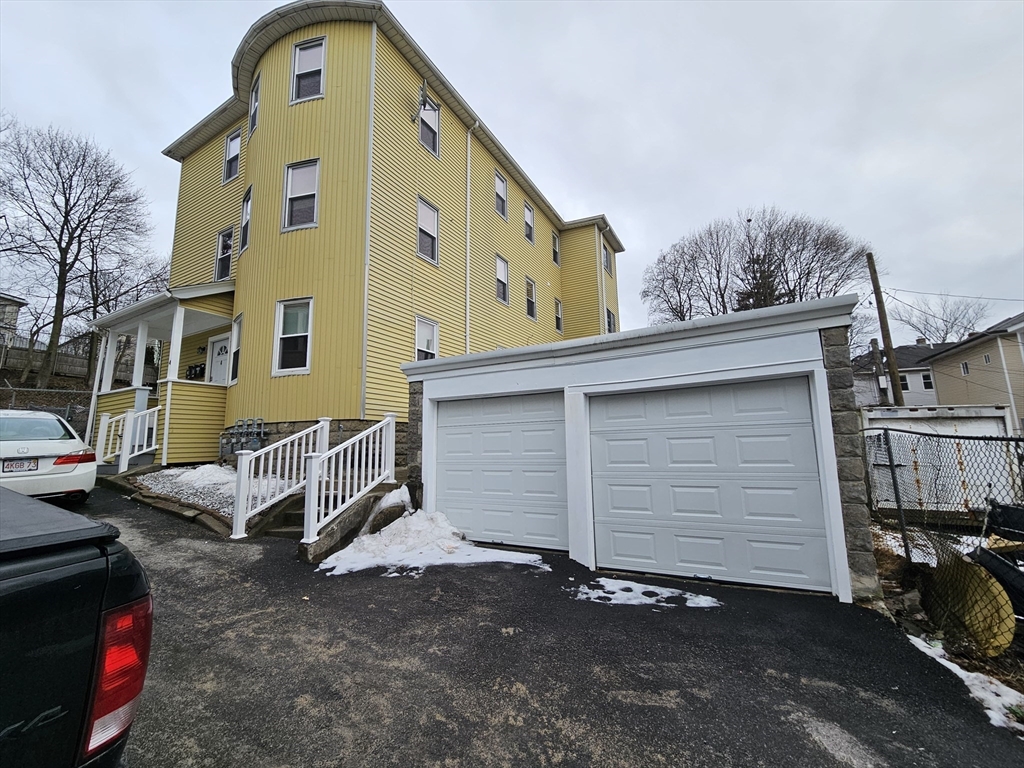 4 Vernon Terrace, Unit 2 Worcester, MA 01610 - Photo 1 of 12 a front view of a house with parking space