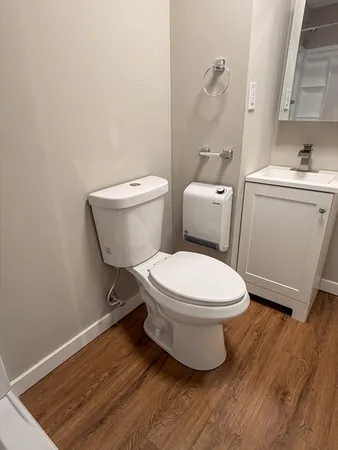 a bathroom with a toilet and a sink
