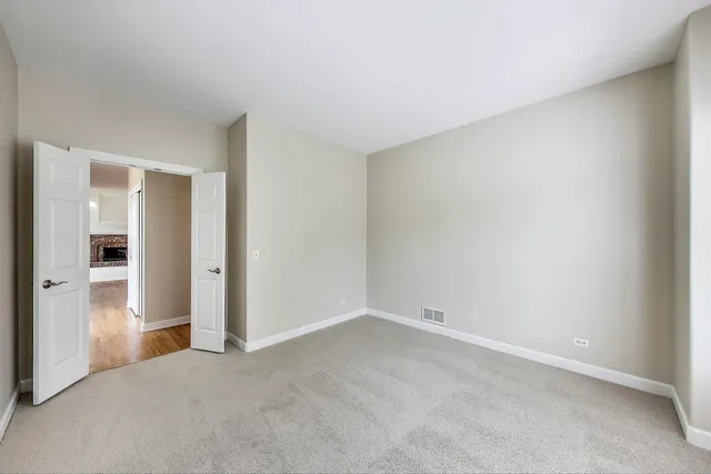 a view of an empty room and closet