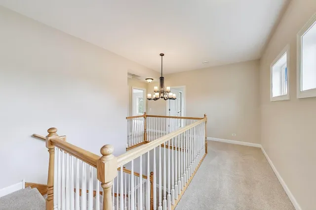 a view of a hallway with windows