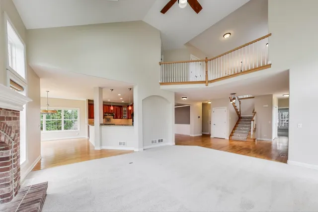 a view of a livingroom with furniture and windows