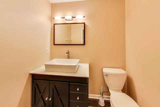 a front view of a house with a yard and porch