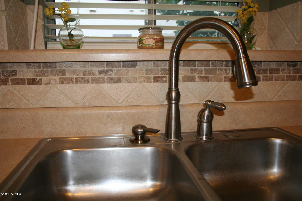 3847 East Simpson Road Gilbert, AZ 85297 - Photo 12 of 35 Striking backsplash wraps around counter