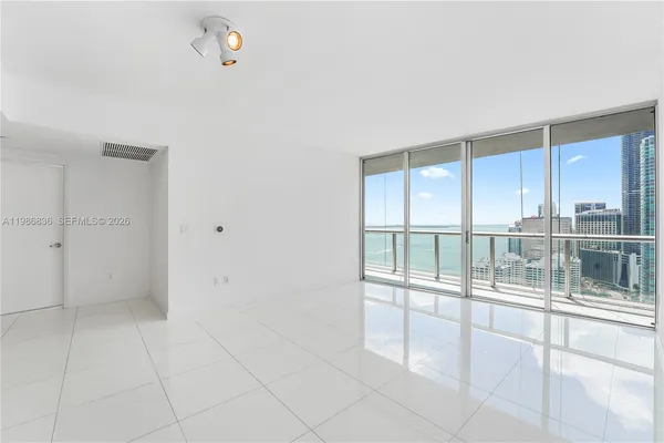 a view of an empty room with a window