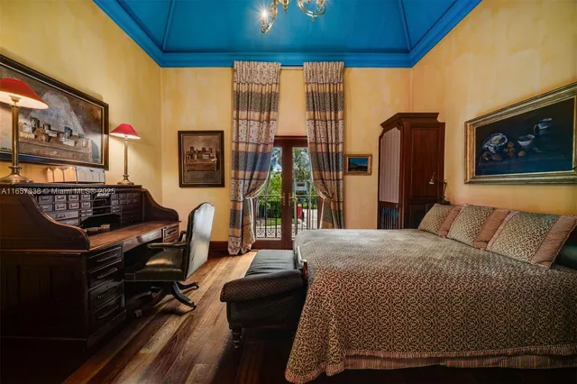 a bedroom with bed and a window