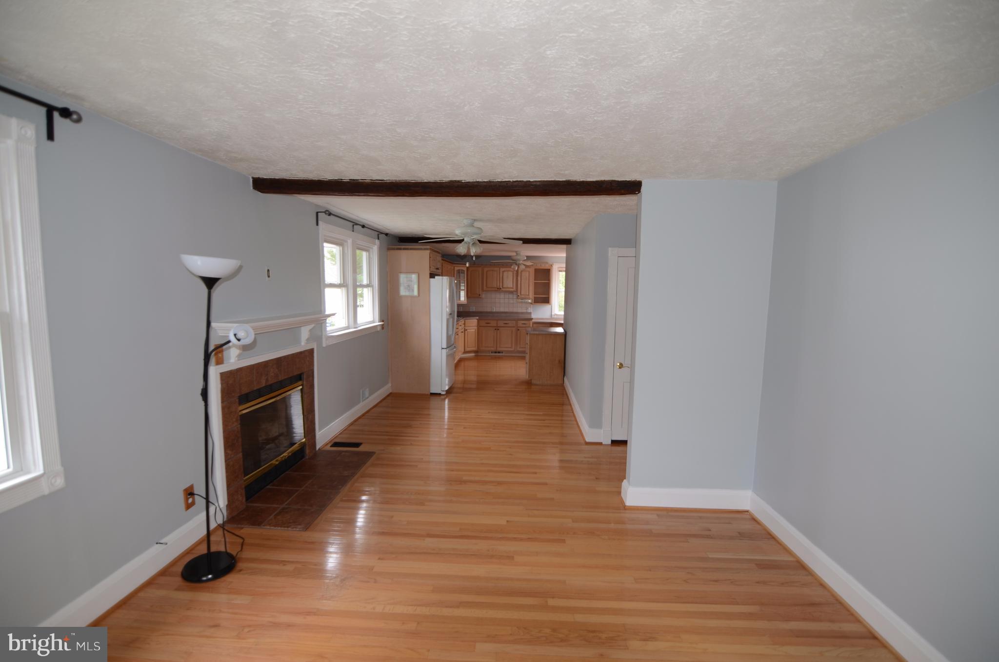 4216 Thorncliff Road Baltimore, MD 21236 - Photo 2 of 20 Living Room/diningroom w/fireplace