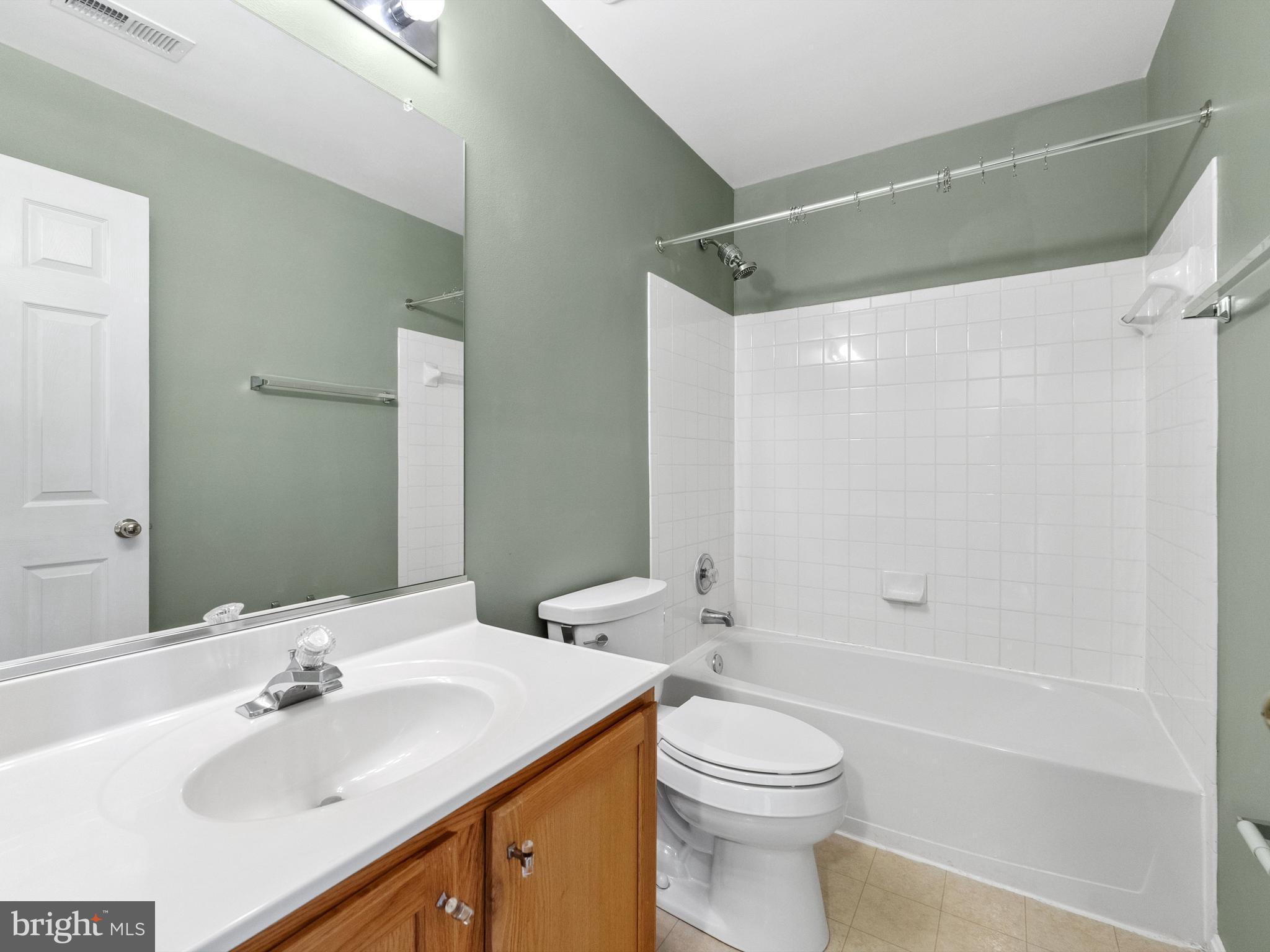 45458 Bluemont Junction Square Sterling, VA 20164 - Photo 17 of 24 a bathroom with a sink a toilet and shower