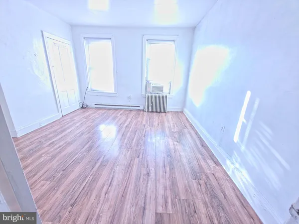 a view of a room that has wooden floor