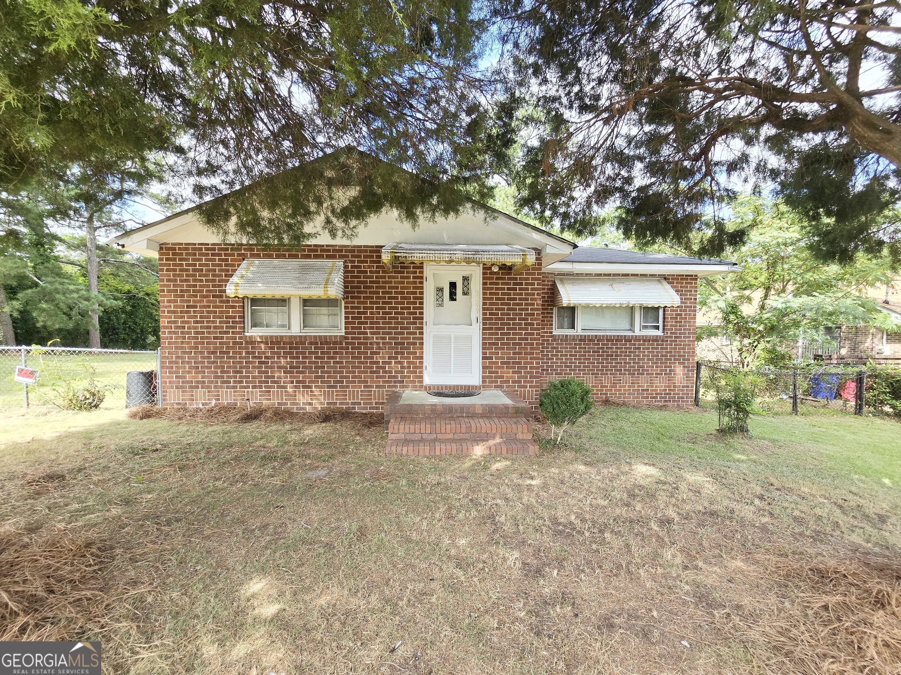 2249 Lowe Street Macon, GA 31206 - Photo 2 of 17 a front view of a house with garden