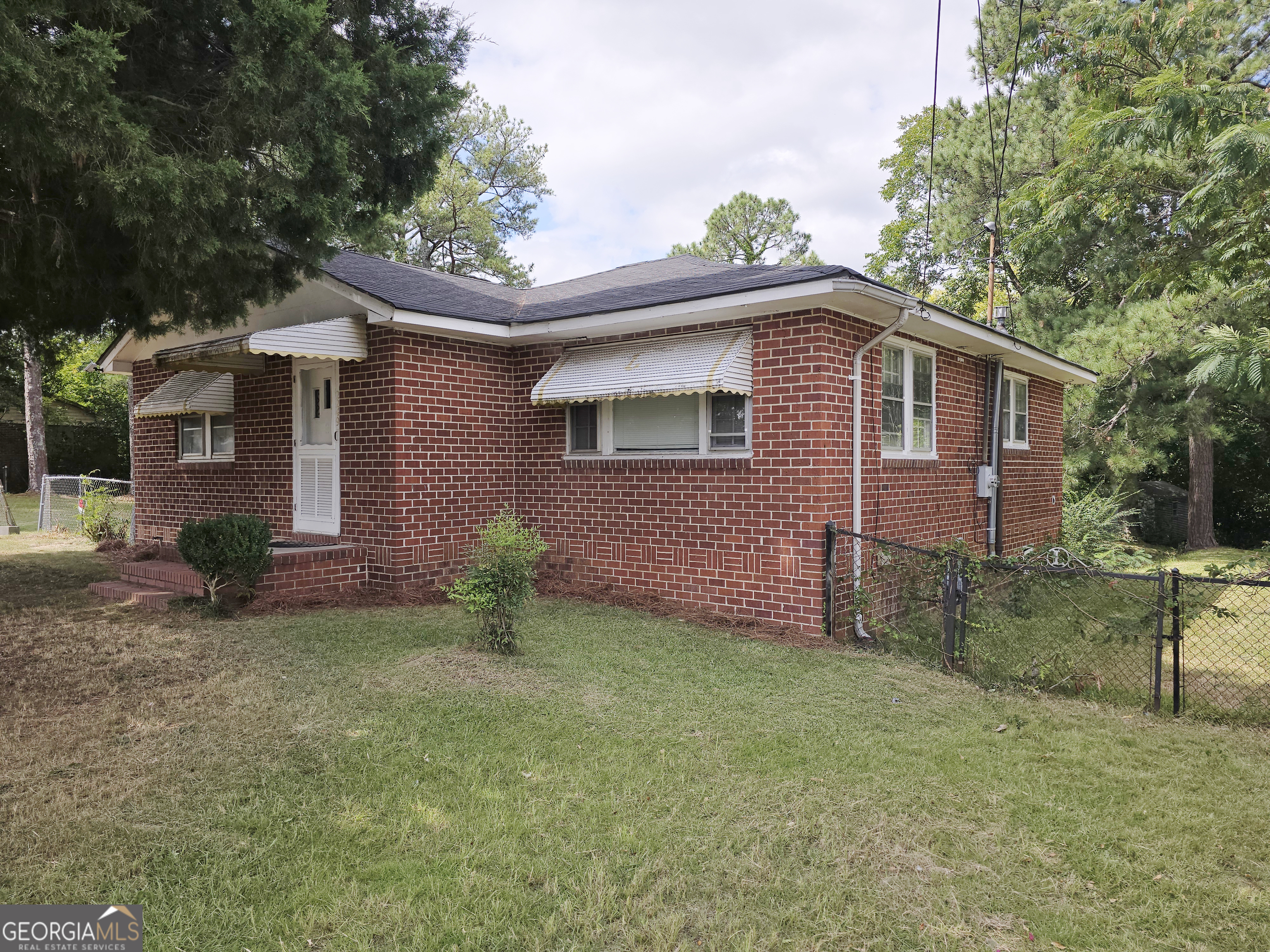 2249 Lowe Street Macon, GA 31206 - Photo 4 of 17 a front view of a house with garden