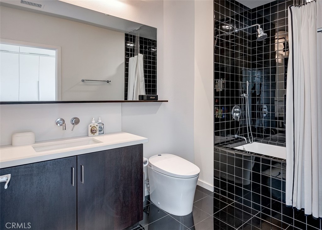 21 Gramercy, Unit 306 Irvine, CA 92612 - Photo 13 of 46 a bathroom with a sink toilet and shower