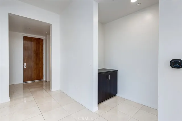 a spacious bedroom with a bed and window