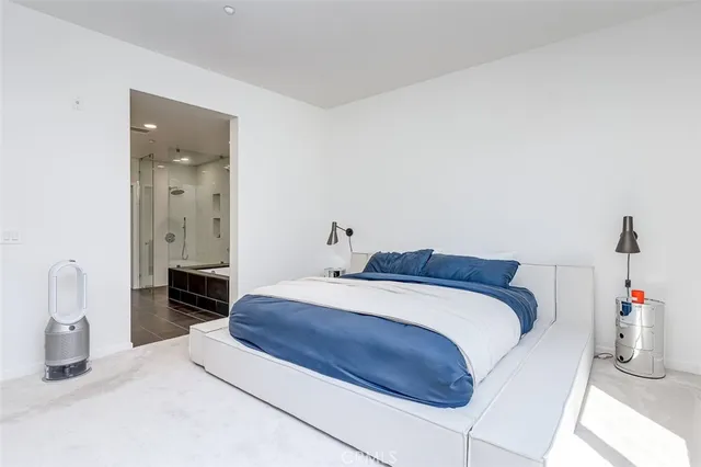 a bathroom with a double vanity sink a toilet and shower