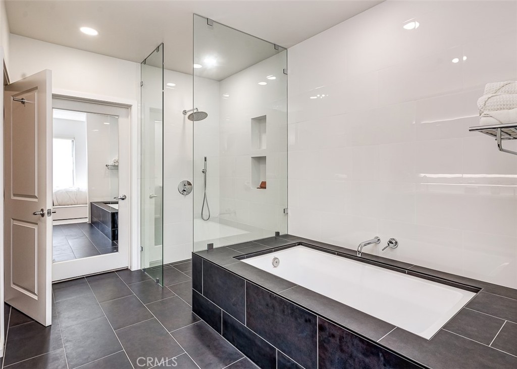 21 Gramercy, Unit 306 Irvine, CA 92612 - Photo 17 of 46 a bathroom with a double vanity sink a toilet and shower