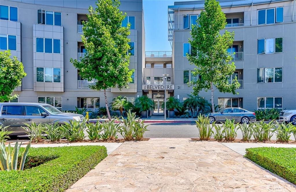 21 Gramercy, Unit 306 Irvine, CA 92612 - Photo 31 of 46 a view of a garden with a bench