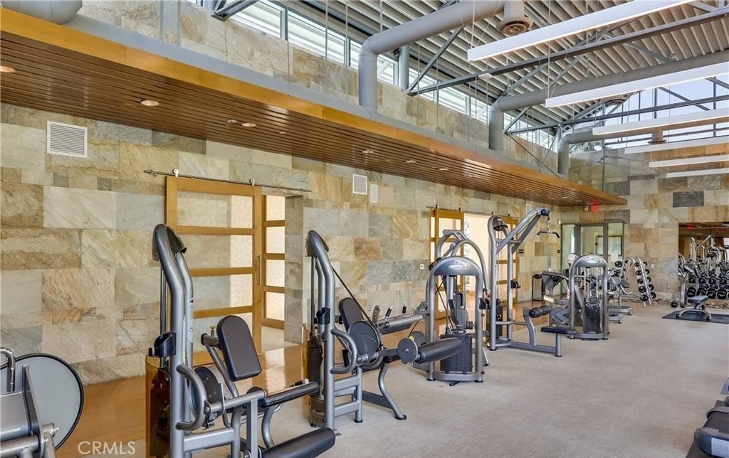 21 Gramercy, Unit 306 Irvine, CA 92612 - Photo 38 of 46 a view of a room with gym equipment