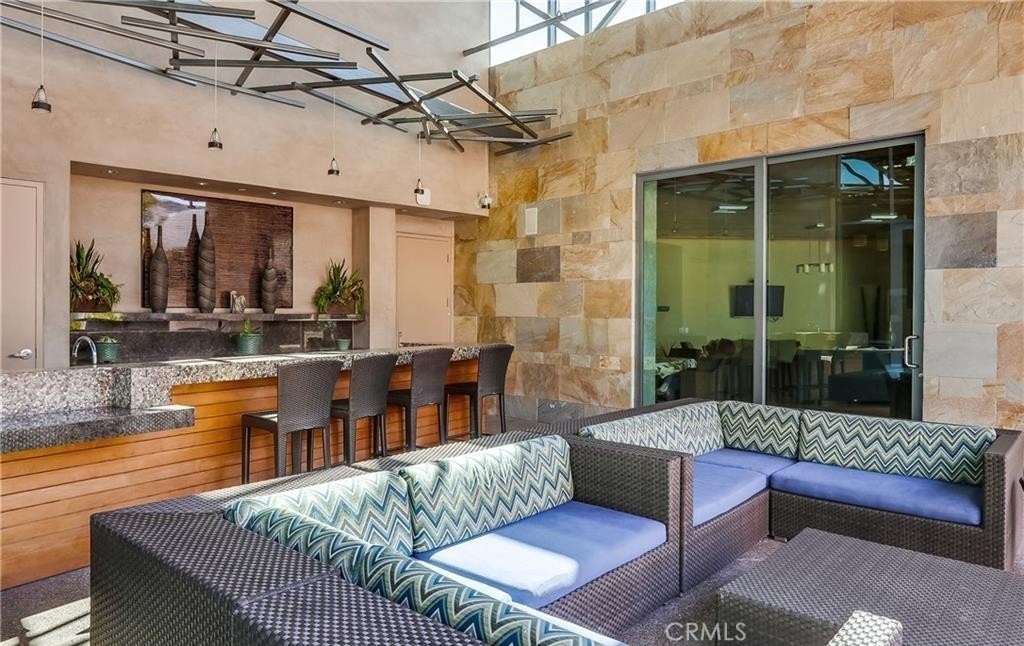 21 Gramercy, Unit 306 Irvine, CA 92612 - Photo 39 of 46 a outdoor living space with furniture and a rug