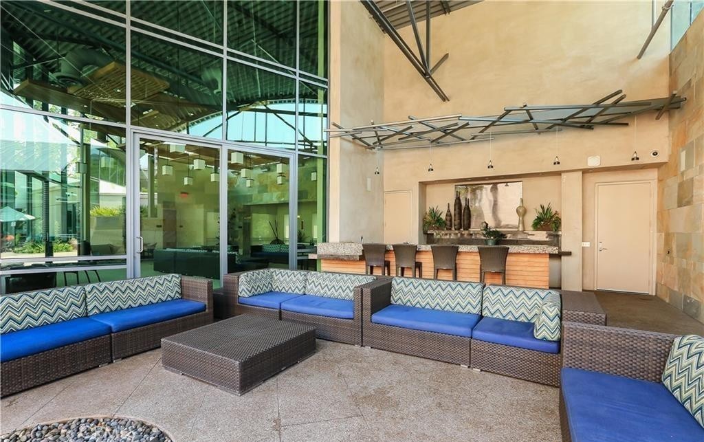 21 Gramercy, Unit 306 Irvine, CA 92612 - Photo 44 of 46 a outdoor living space with couch