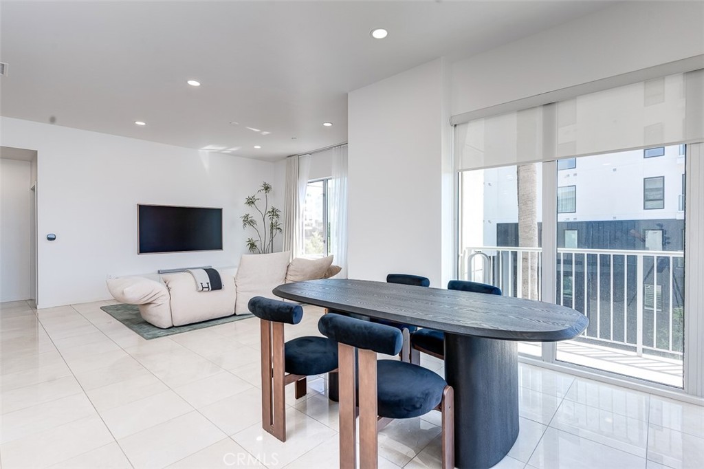 21 Gramercy, Unit 306 Irvine, CA 92612 - Photo 10 of 46 a view of a dining room with furniture and a window