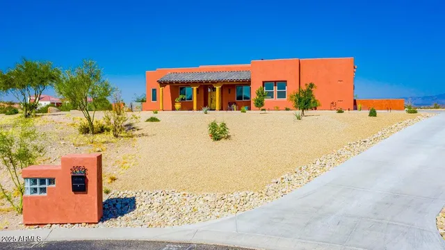 a backyard of a house with yard and outdoor seating