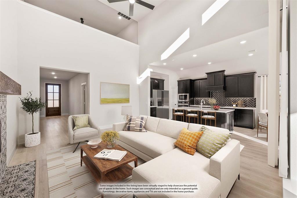 38 Osprey Street Joshua, TX 76058 - Photo 11 of 37 a living room with furniture kitchen view and a chandelier