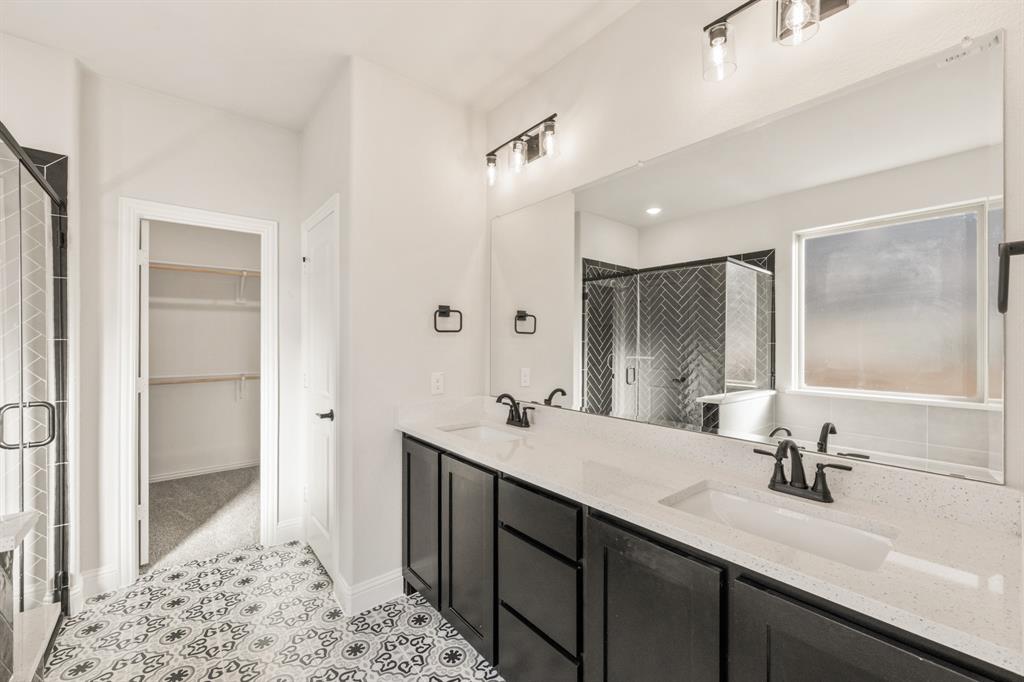 38 Osprey Street Joshua, TX 76058 - Photo 24 of 37 a bathroom with a sink double vanity and a mirror