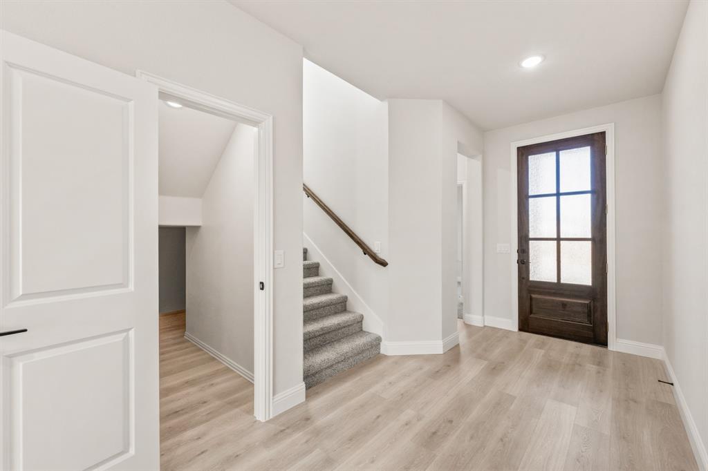 38 Osprey Street Joshua, TX 76058 - Photo 5 of 37 a view of entryway with wooden floor and stairs