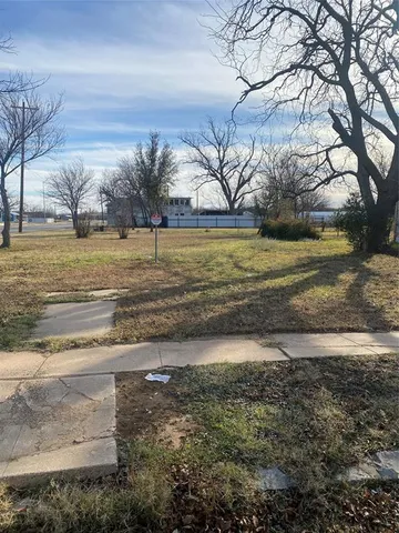 a view of a yard with an outdoor space