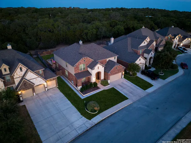 an aerial view of a house with pool