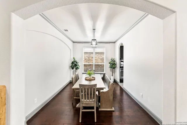 a spacious bedroom with a large bed a flat tv screen and large closet