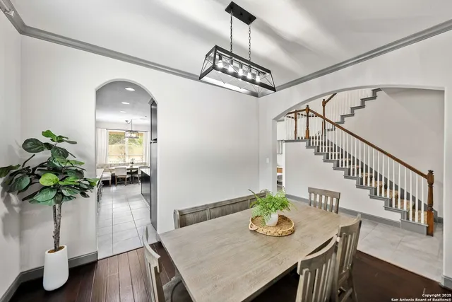 a bathroom with a tub sink shower and mirror