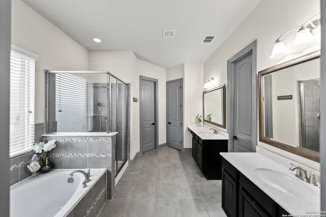 a living room with furniture a flat screen tv and a window