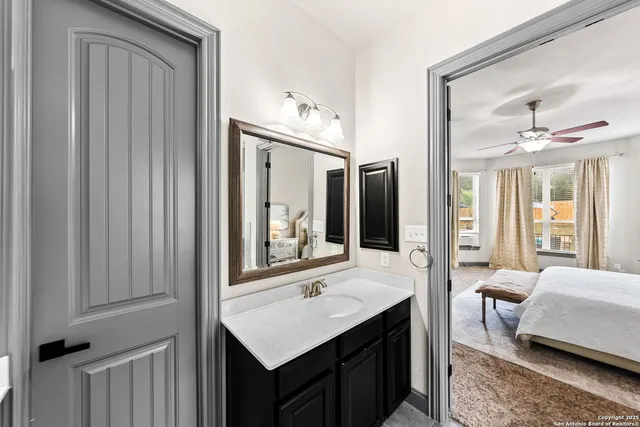 a living room with furniture a chandelier and a large window