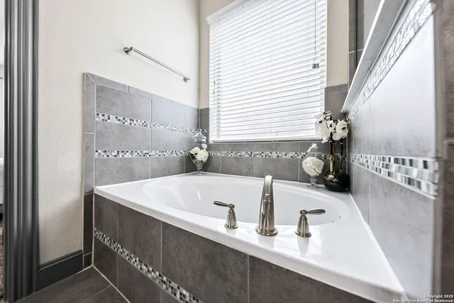 a kitchen with a stove and cabinets