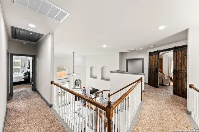 a bedroom with furniture and a baby crib