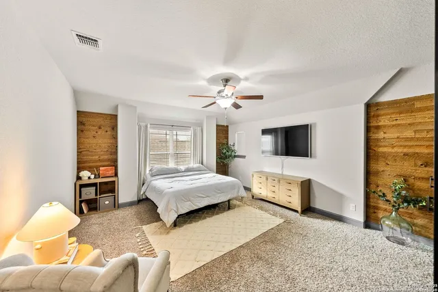 a bathroom with double vanity sink and a mirror
