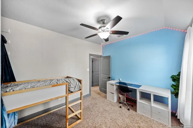 a view of a dinning table and chairs in patio of the house