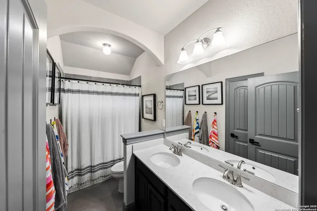 an aerial view of residential houses with yard