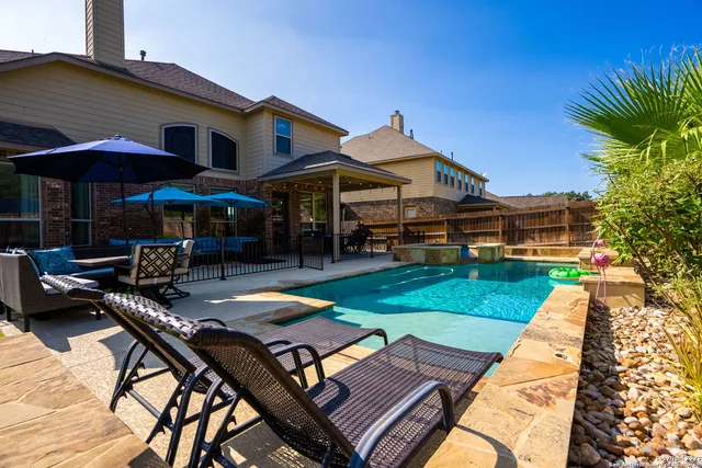 a view of a patio with swimming pool