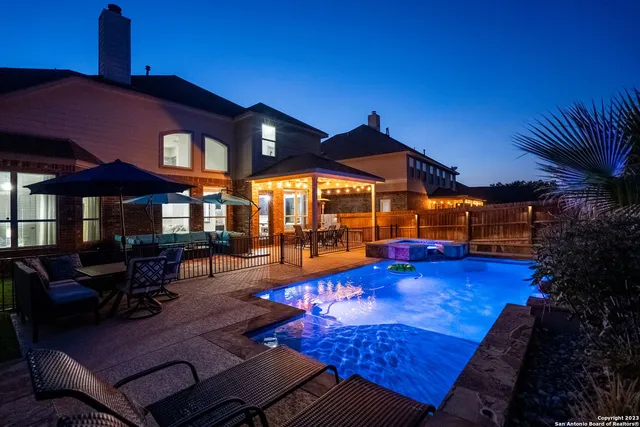 a view of swimming pool with a patio