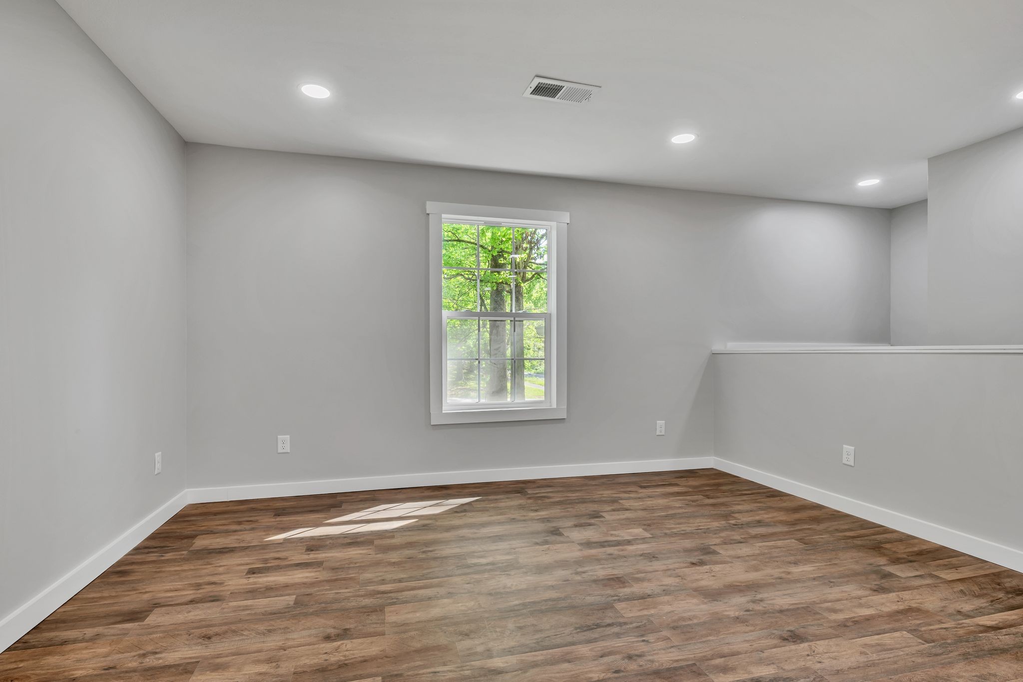 120 Bern Street Waverly, TN 37185 - Photo 12 of 36 wooden floor in an empty room with a window