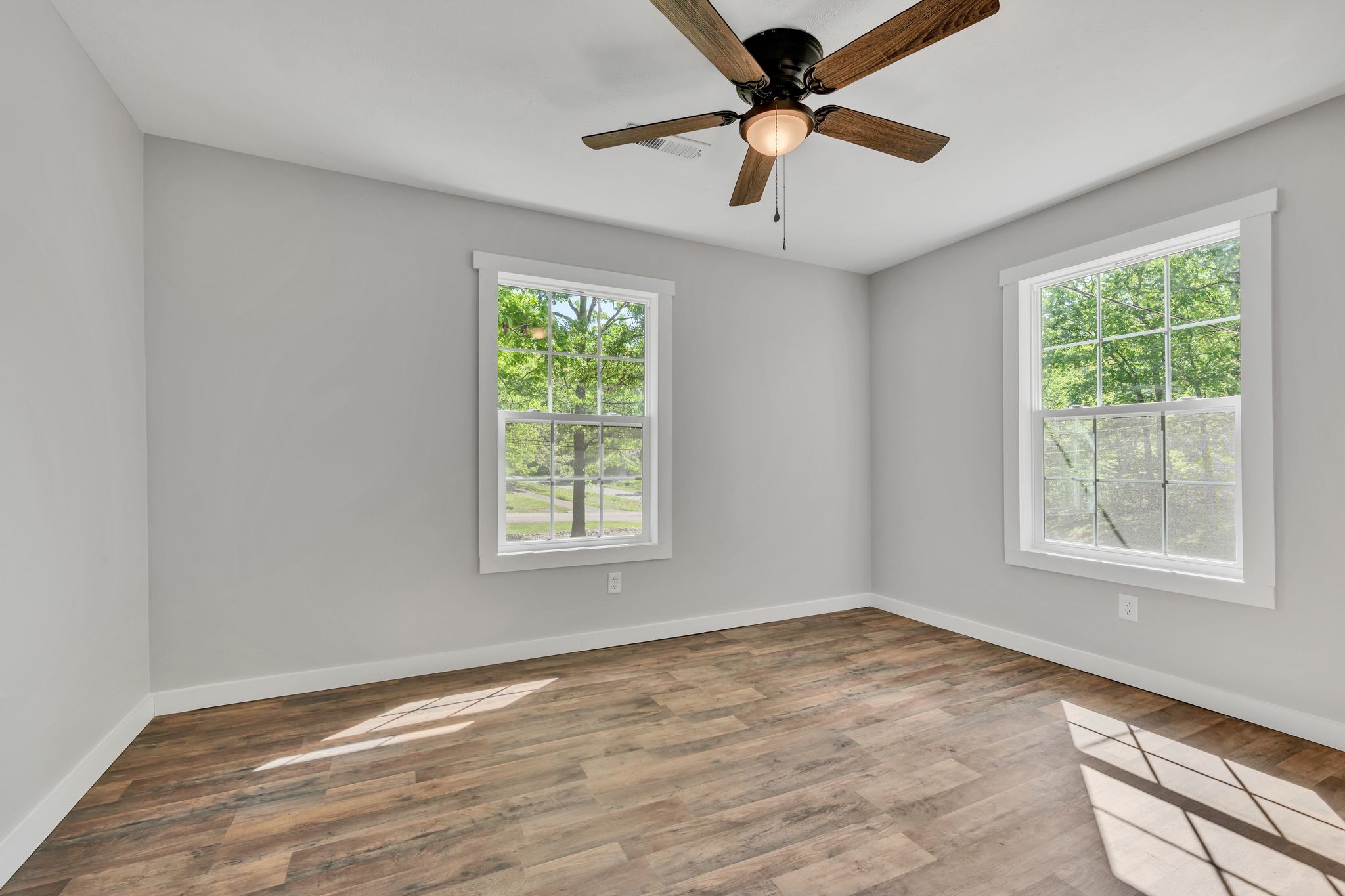 120 Bern Street Waverly, TN 37185 - Photo 18 of 36 an empty room with a window and a fan