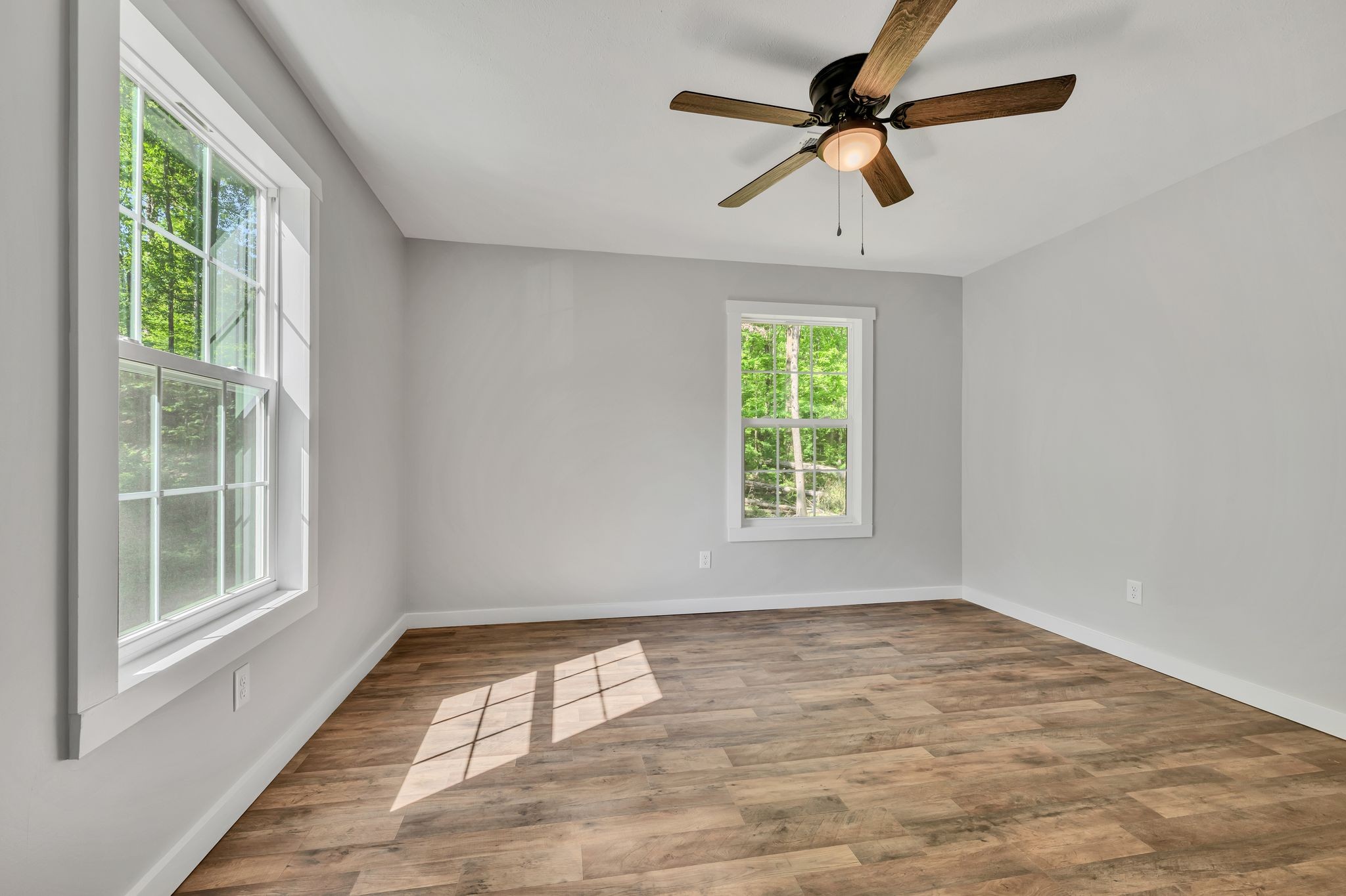 120 Bern Street Waverly, TN 37185 - Photo 21 of 36 wooden floor in an empty room with a window