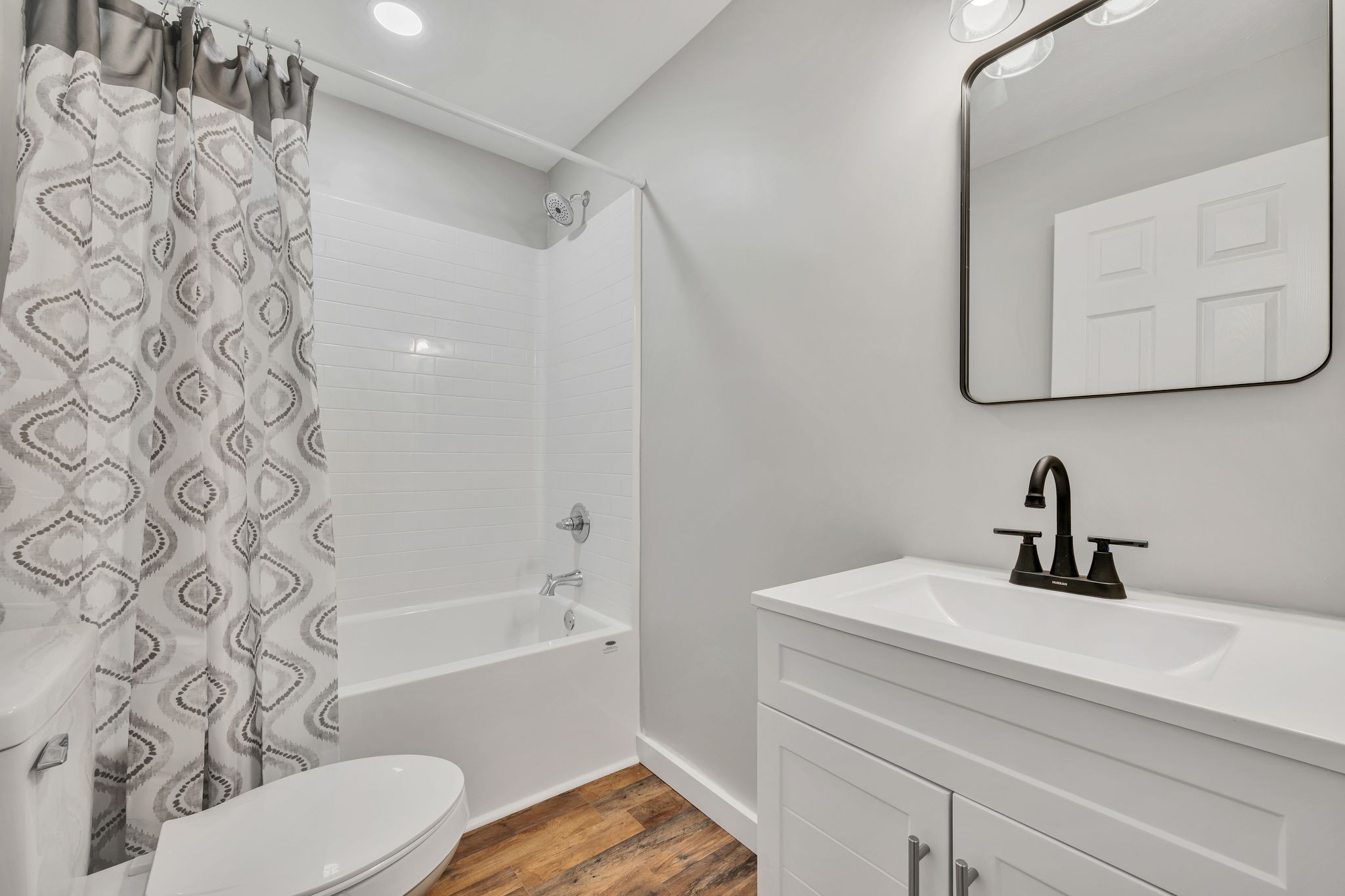 120 Bern Street Waverly, TN 37185 - Photo 22 of 36 a bathroom with a sink and a mirror