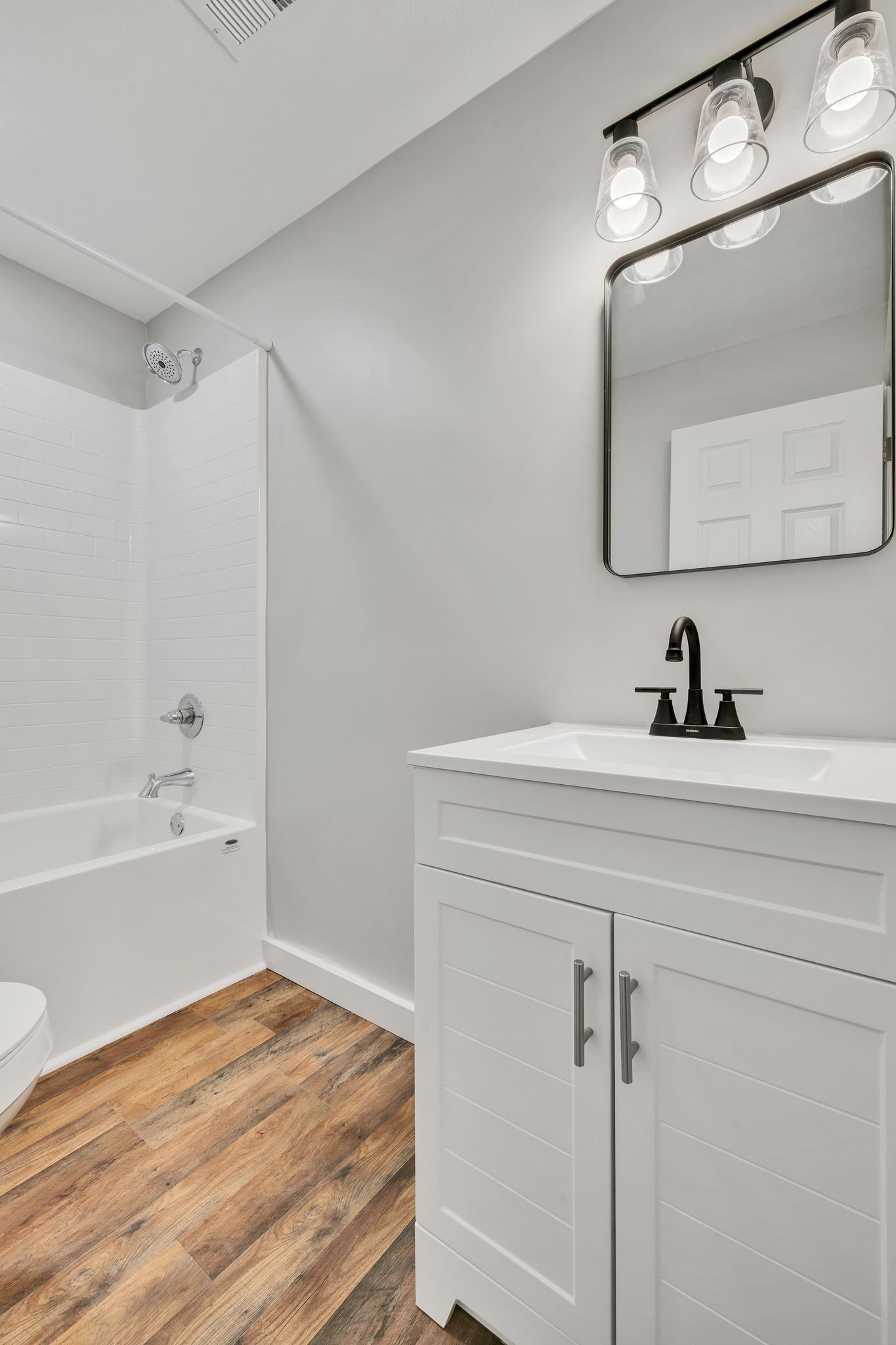 120 Bern Street Waverly, TN 37185 - Photo 23 of 36 a bathroom with a sink and a mirror